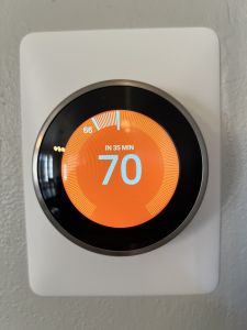 Thermostat with display showing temperature