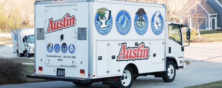 Austin Plumbing, Heating & Air truck responding to a water heater emergency