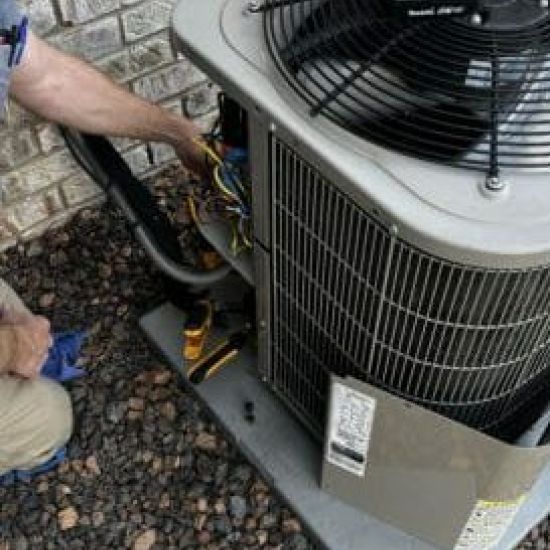 Man installing an AC